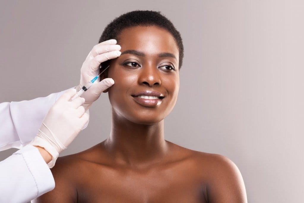 Woman getting injectable treatment