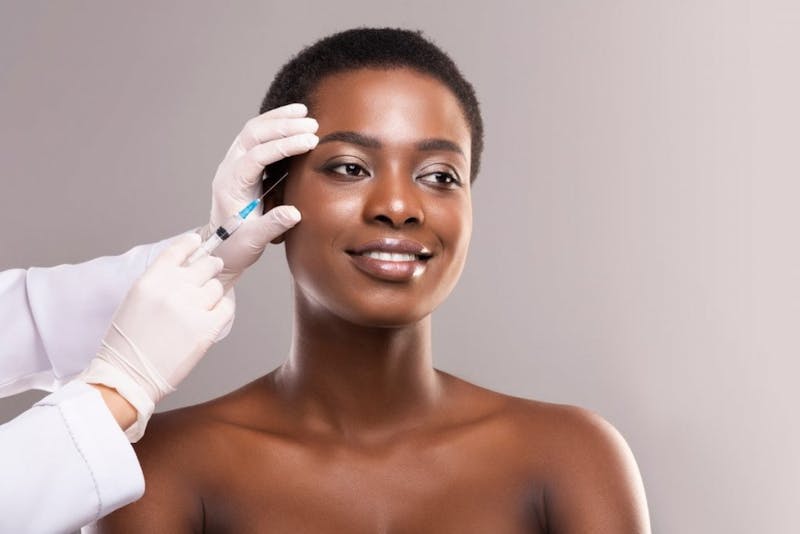 Woman getting injectable treatment