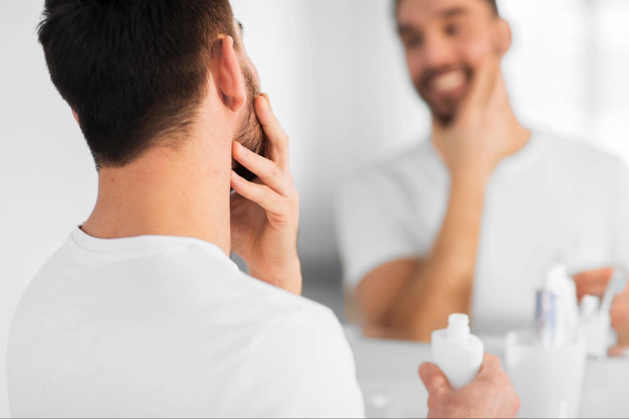 Man applying product to his face