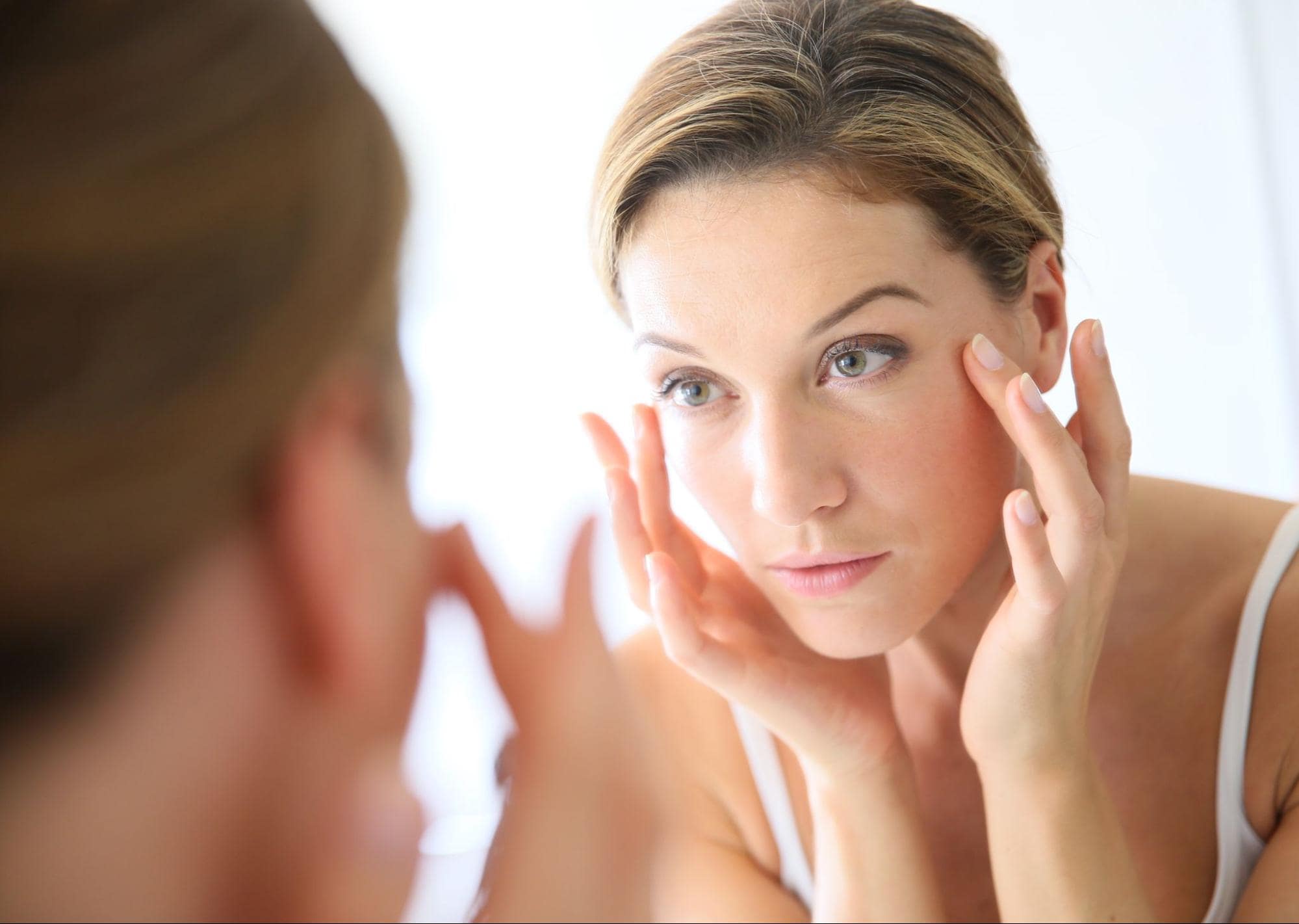 Woman touching her face