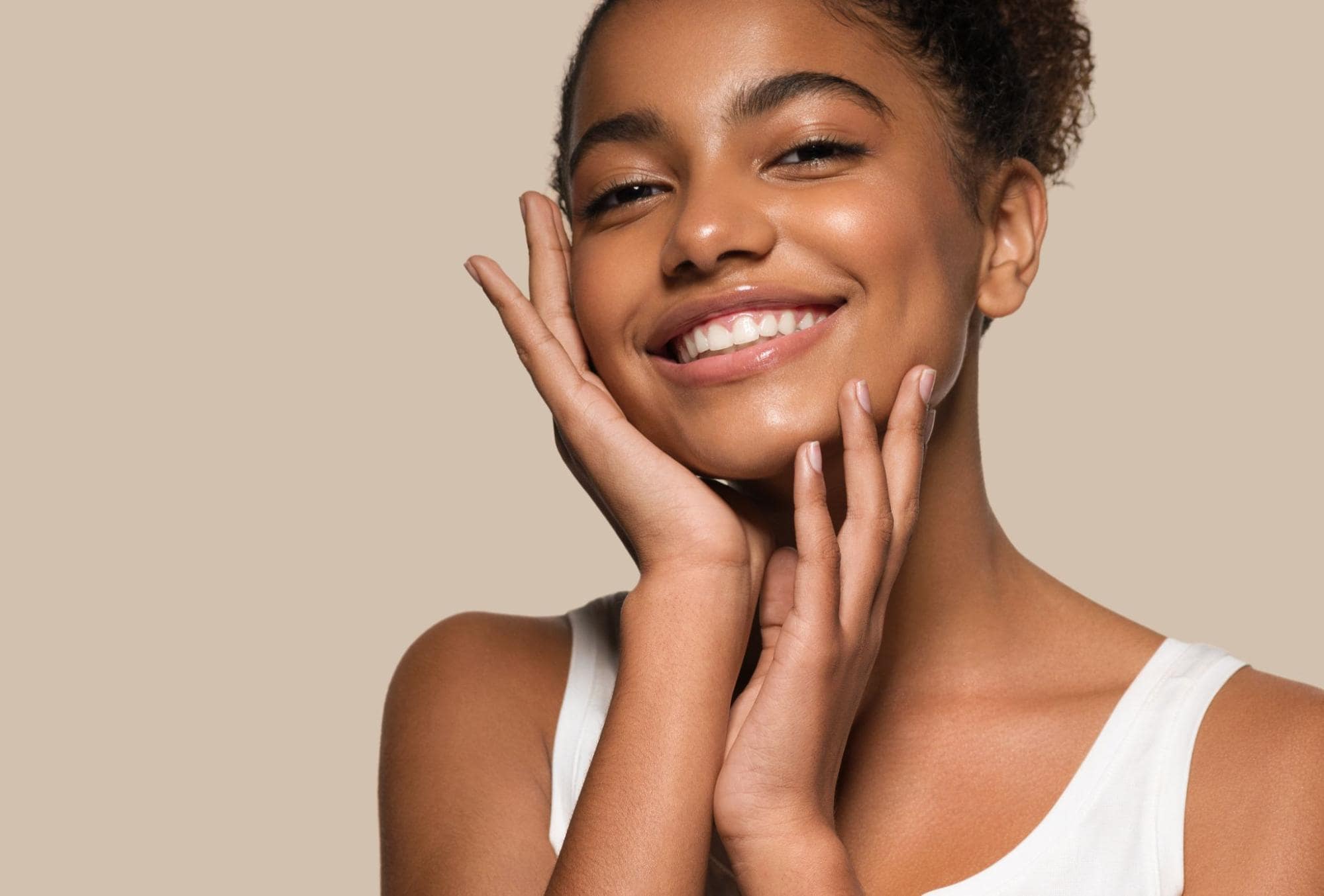 Woman touching her face and smiling