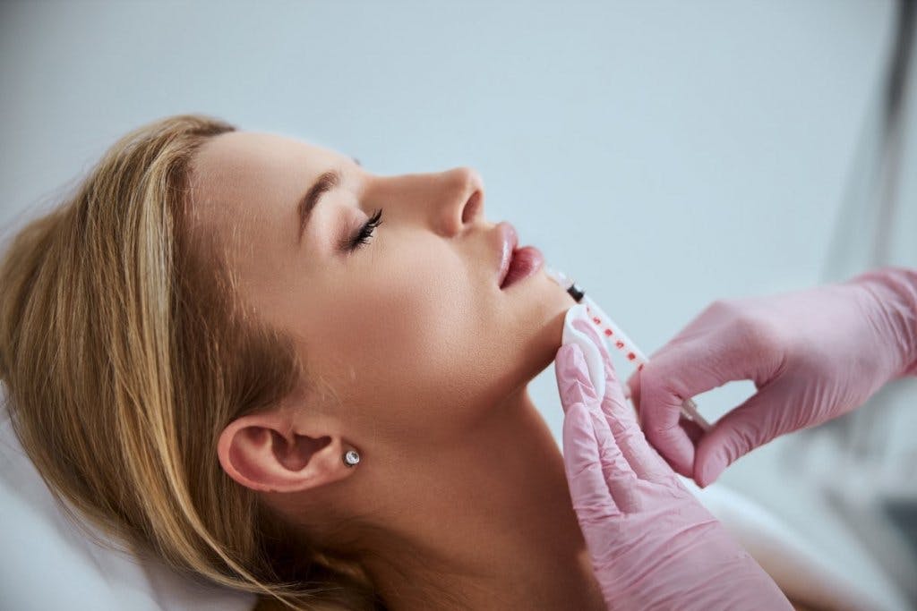 Woman recieving injectable treatment