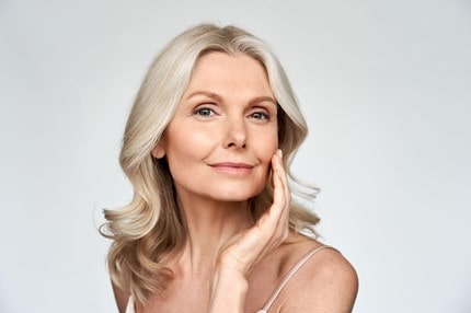 woman touching her face