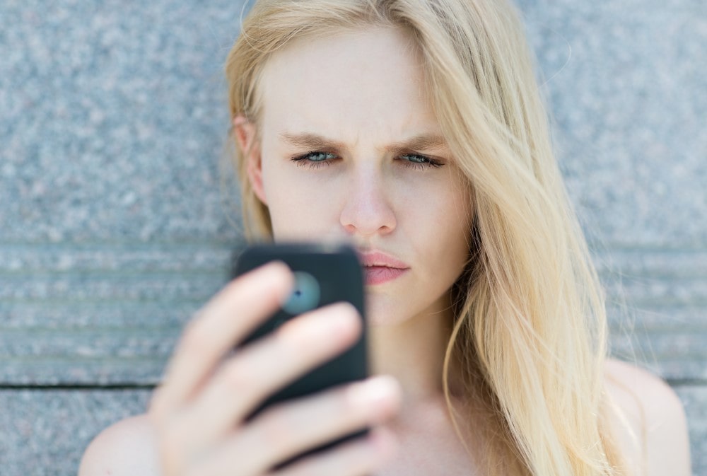 woman looking at her cellphone