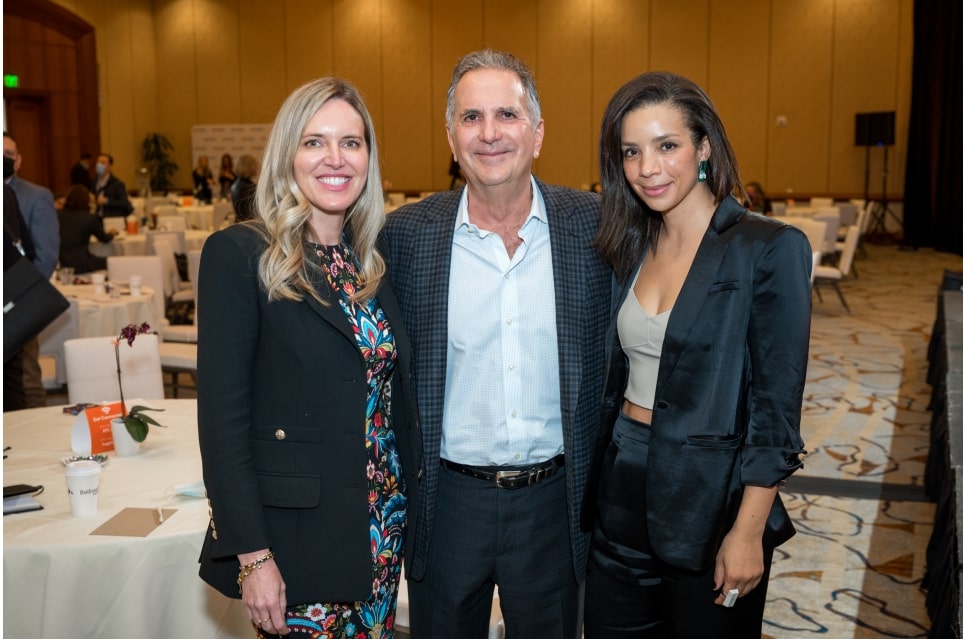 Dr. Z at a conference posing with other people