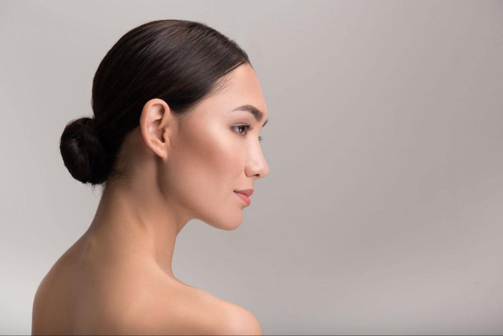 woman with a low slicked back bun