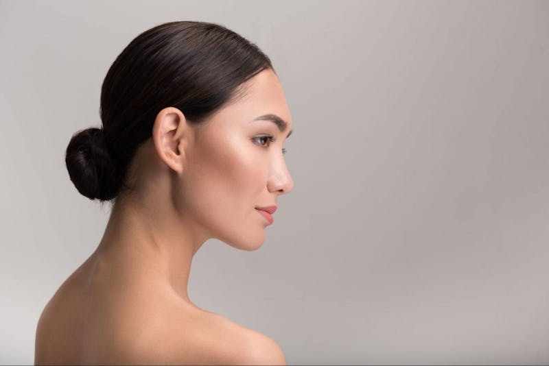 woman with a low slicked back bun