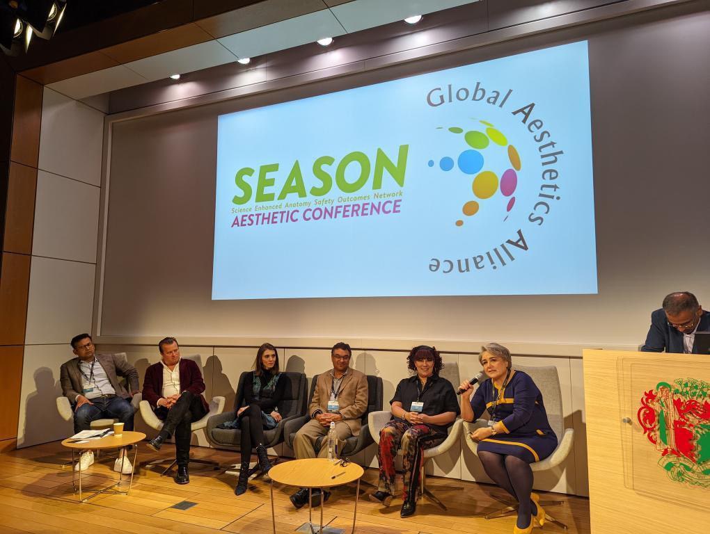 group of doctors sitting down at a conference