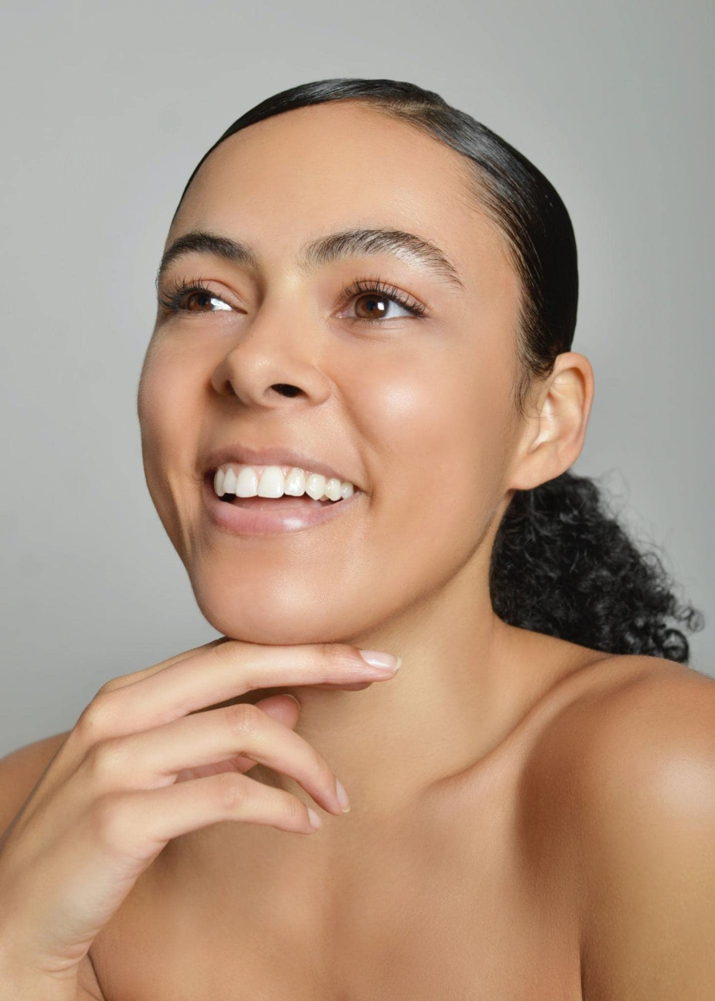 woman with clear skin smiling