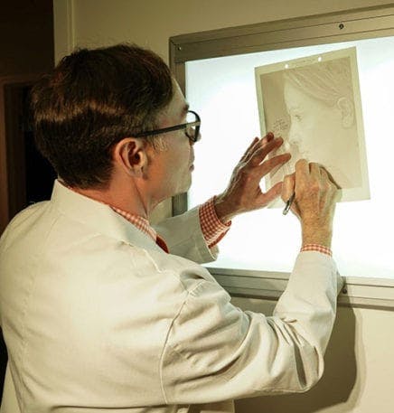 doctor looking at a patients photos