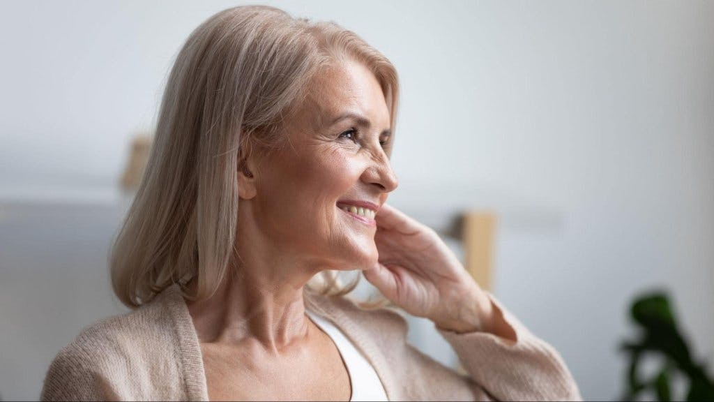 woman with shoulder length hair smiling