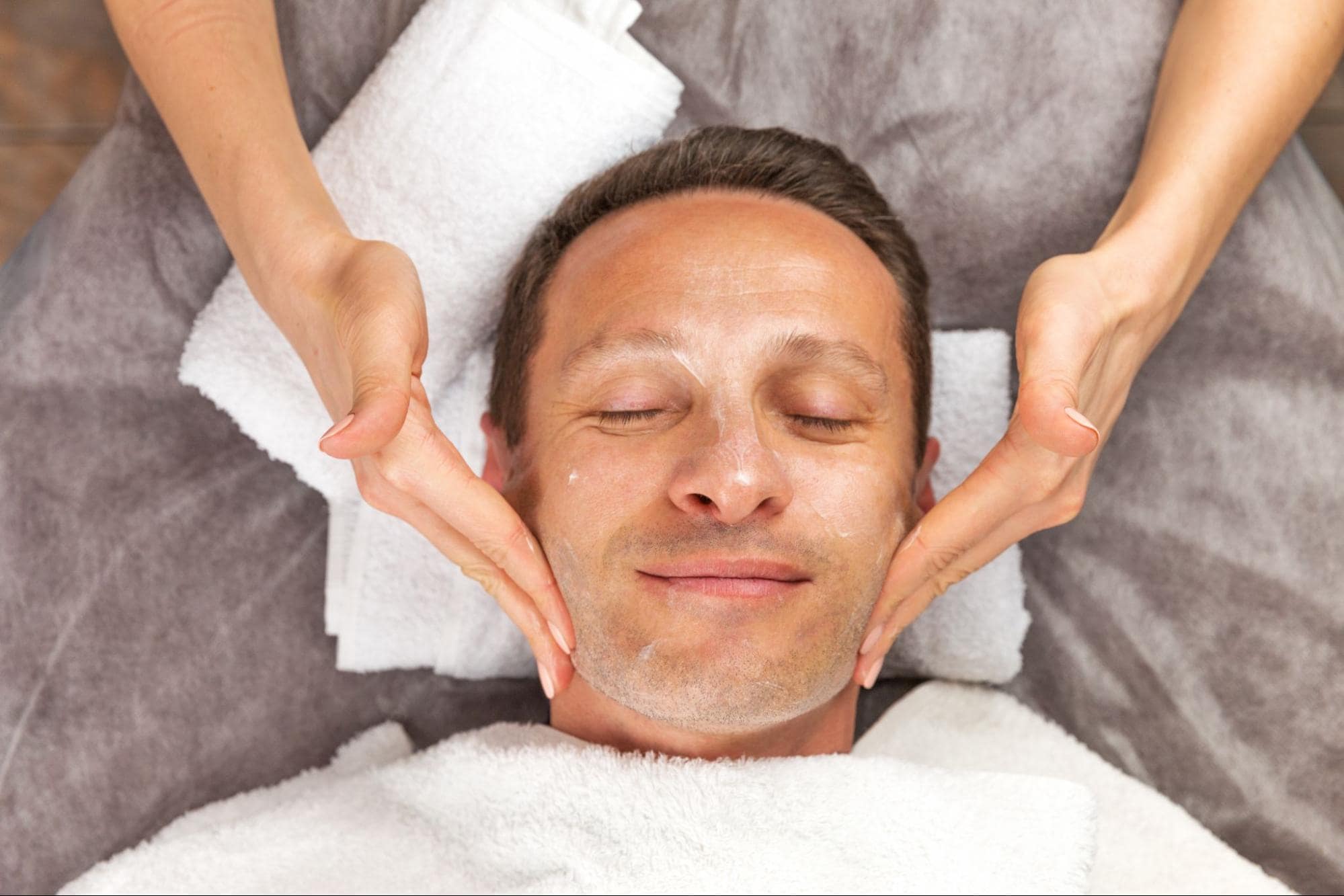man getting a facial
