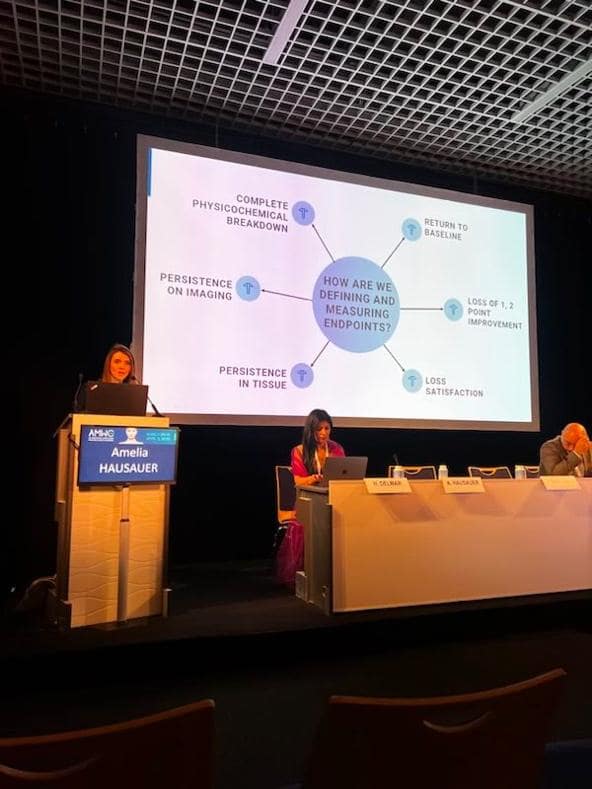 people speaking at a conference