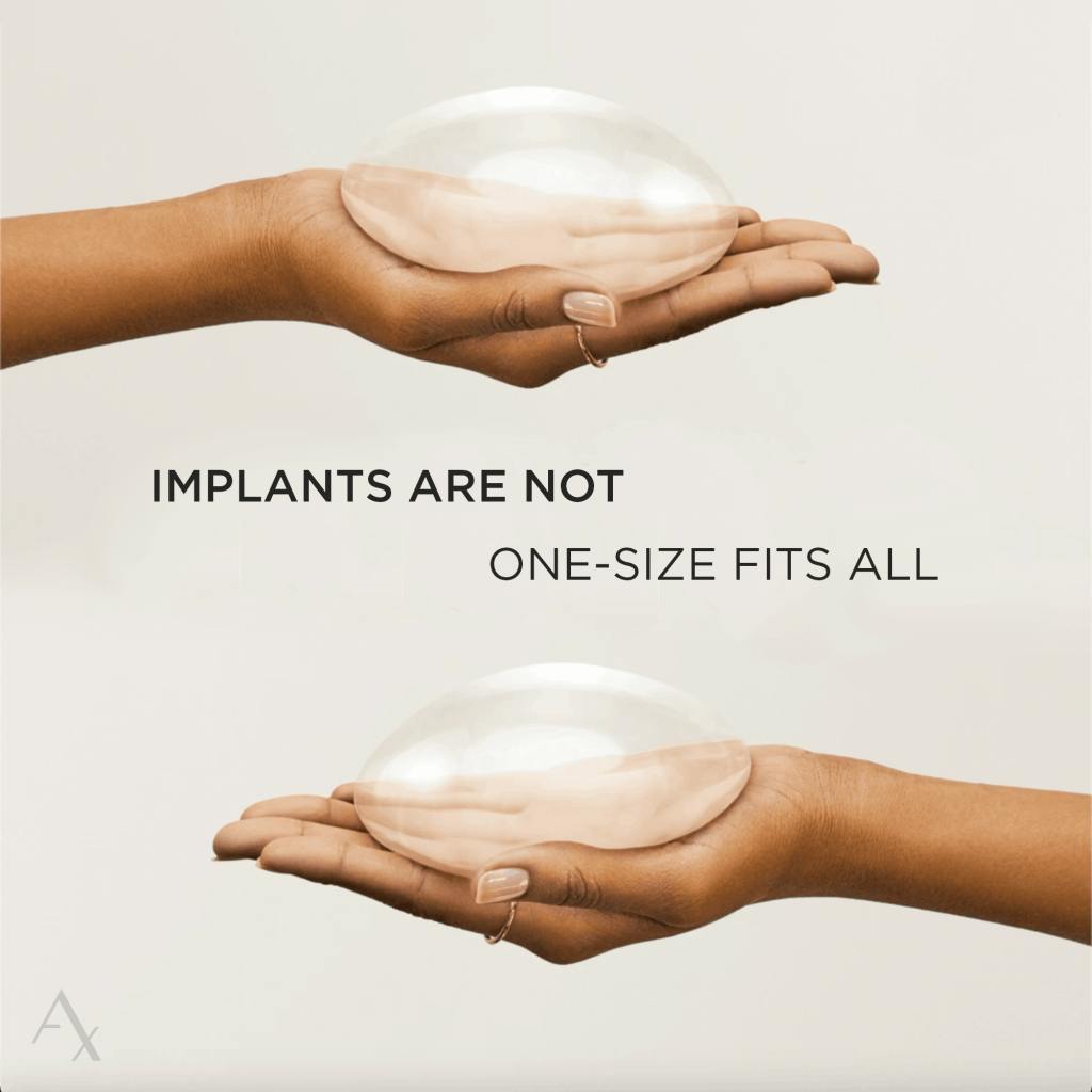 someone holding breast implants