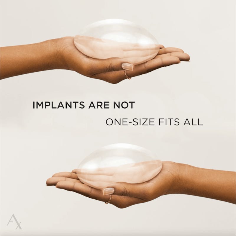 someone holding breast implants