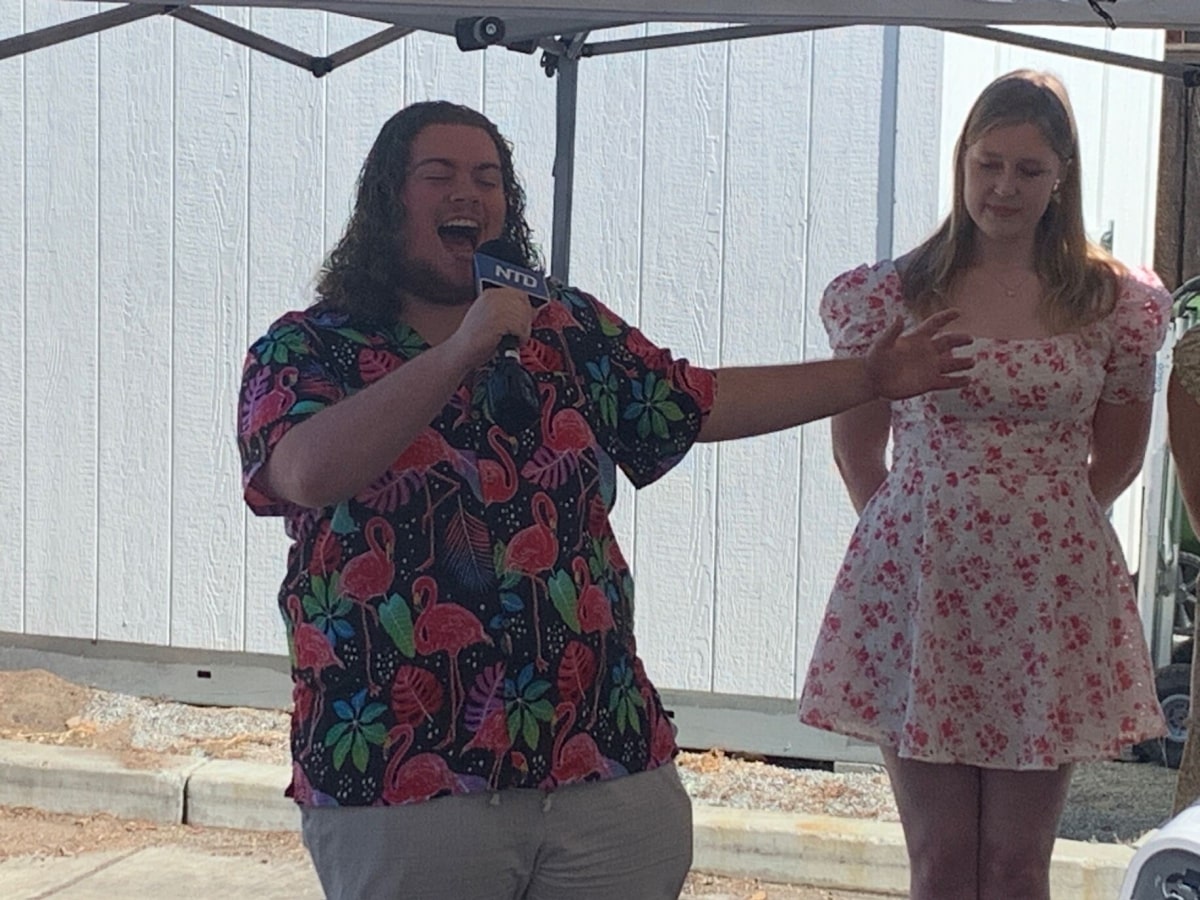 someong singing into a microphone