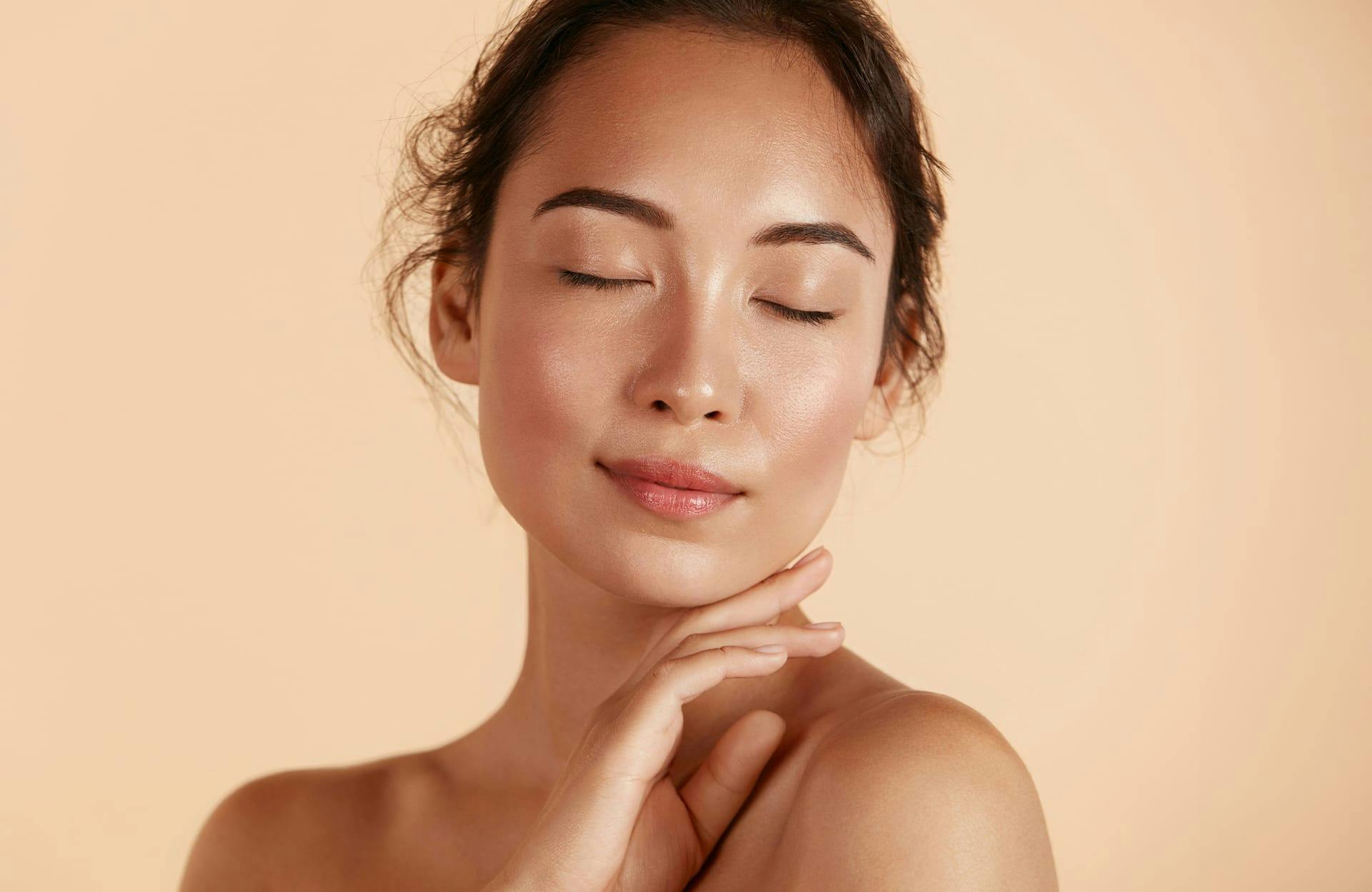 woman feeling chin
