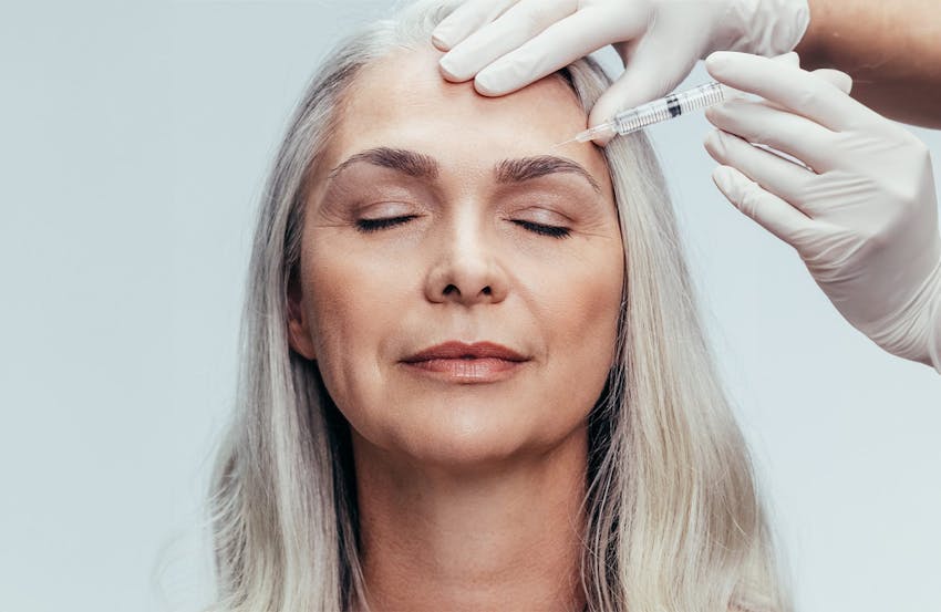 Woman touching face