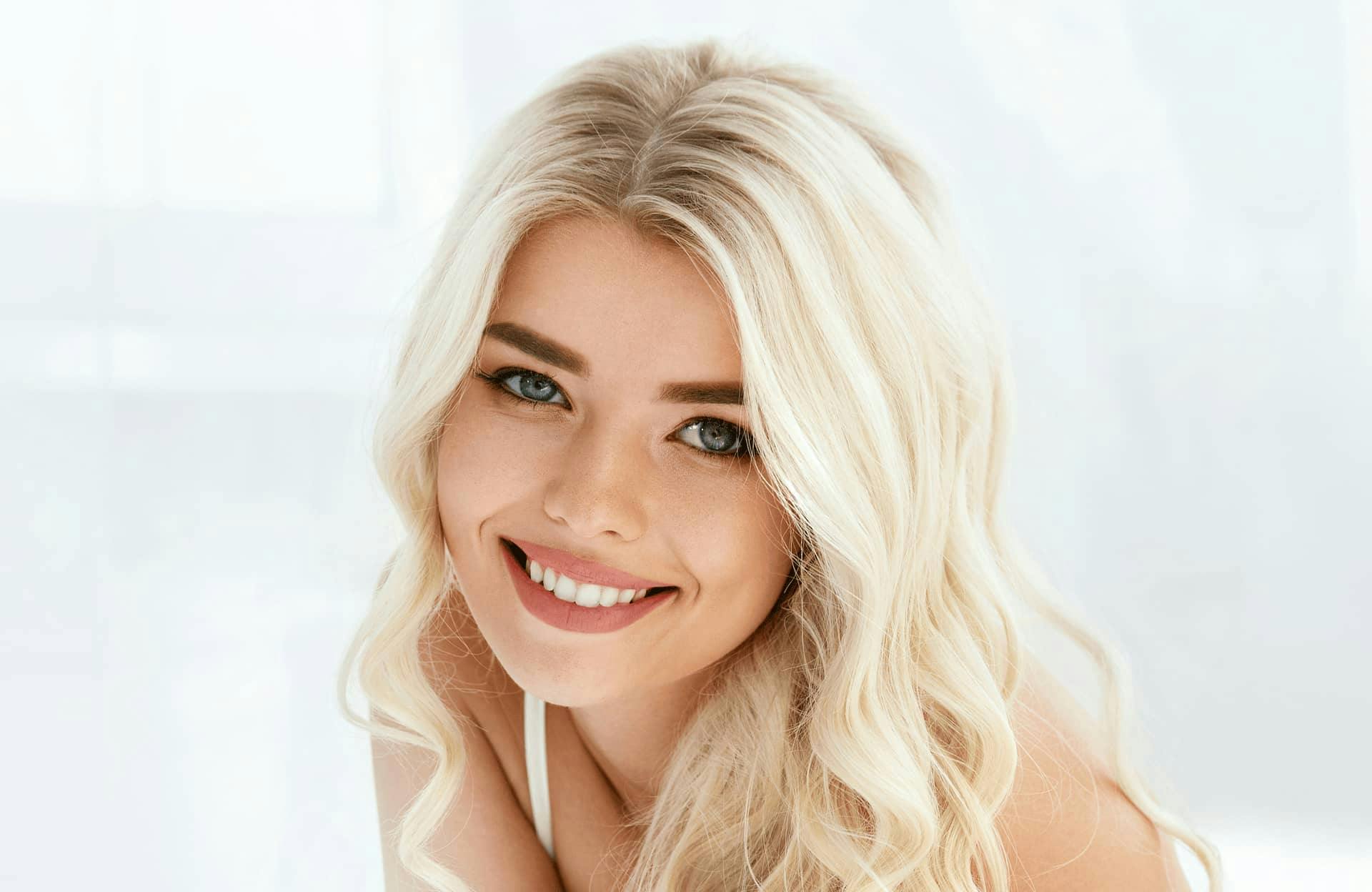 beautiful young blonde woman smiling