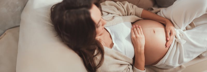 Pregnant mother rests on couch, questions neuromodulators