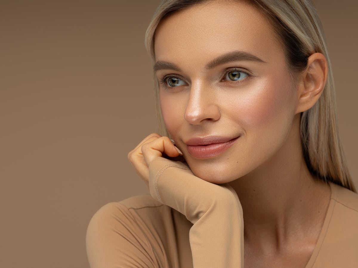 Beautiful woman with rebewed skin after BBL at aesthetx