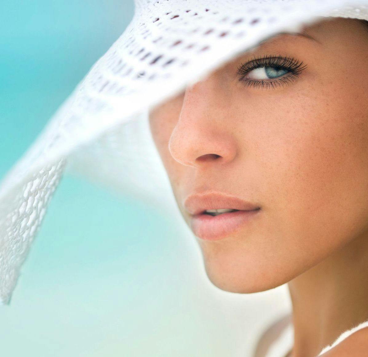 Portrait of a fresh and lovely woman at the beach