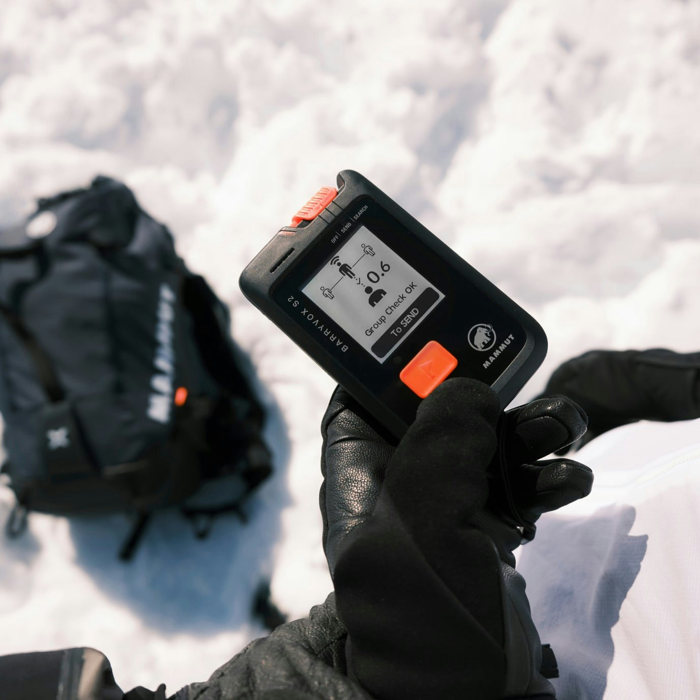 A hand holding a Barryvox device.