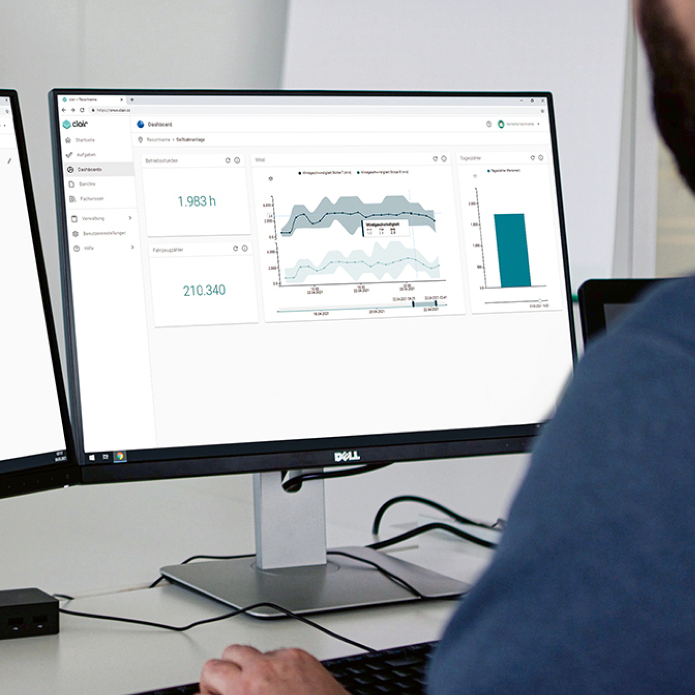 A computer screen with the clair App dashboard visible, seen from over someone's shoulder.