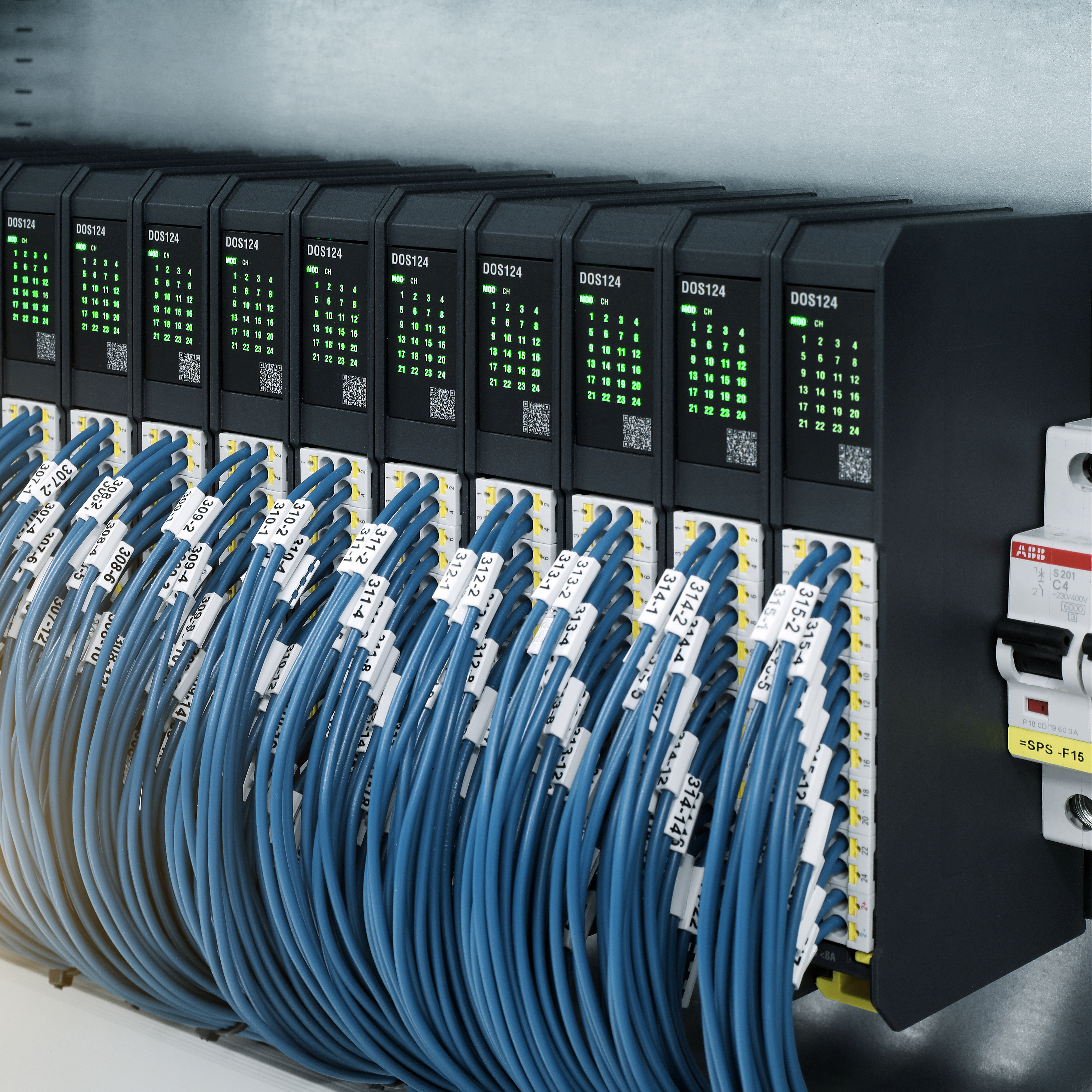 A series of modules from the M100 series with numerous blue cables