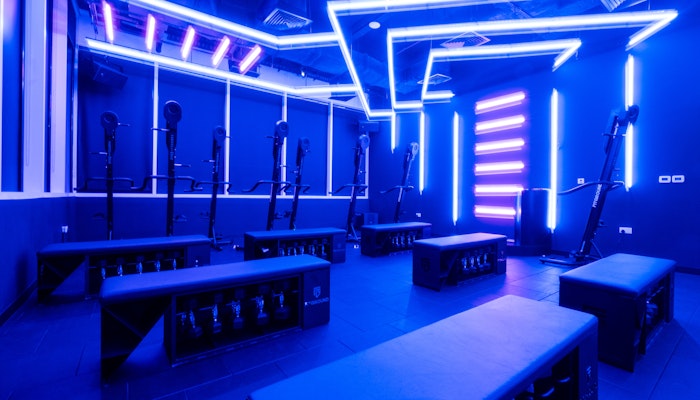 FitGround Modern fitness studio with neon lighting and exercise equipment