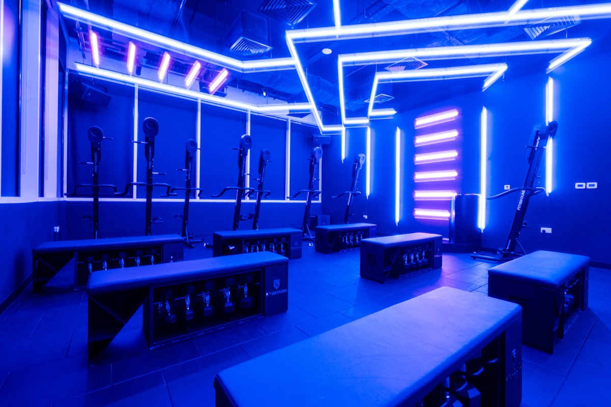 FitGround Modern fitness studio with neon lighting and exercise equipment