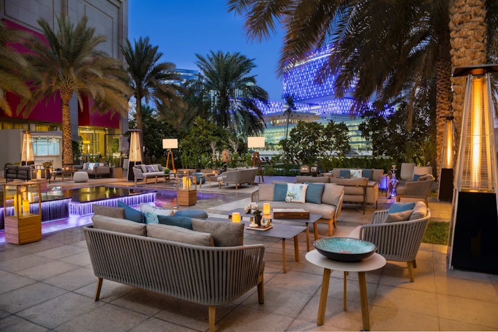 Al Shorfa Lounge, Beach Rotana Featuring comfortable lounge furniture, with a view of sunset