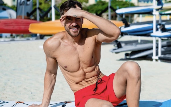 Healthy guy relaxing on the beach