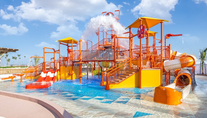 JA Beach Resort Colorful water park with slides, water features, and a splash zone.