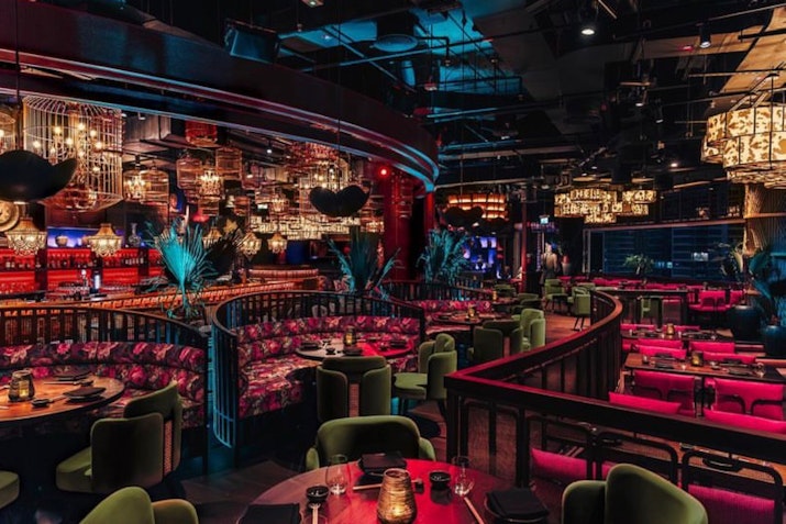 Colorful and luxurious interior with dim lighting and eclectic decor.