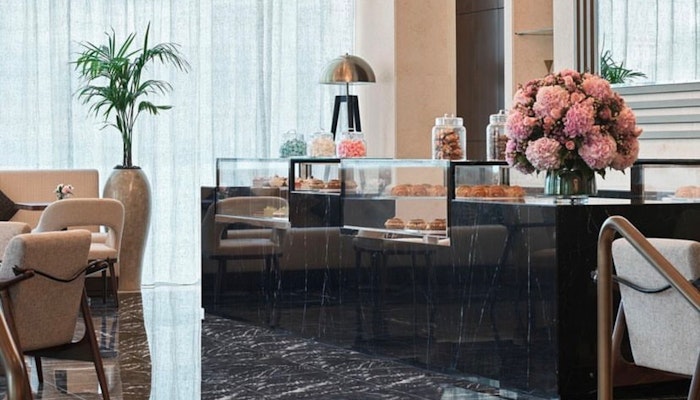Bijou Patisserie at Sofitel Dubai The Obelisk: indulge in elegance and delightful pastries. Bijou Patisserie, Sofitel Dubai The Obelisk: chic patisserie with floral decor and a display of pastries.