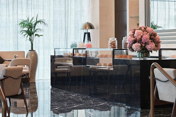 Bijou Patisserie, Sofitel Dubai The Obelisk: chic patisserie with floral decor and a display of pastries.