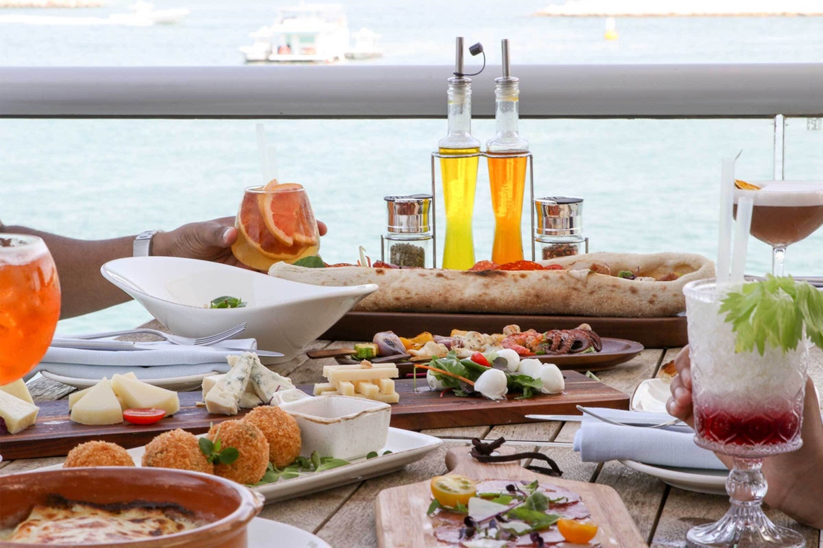 Indulge in waterfront dining with a vibrant spread.