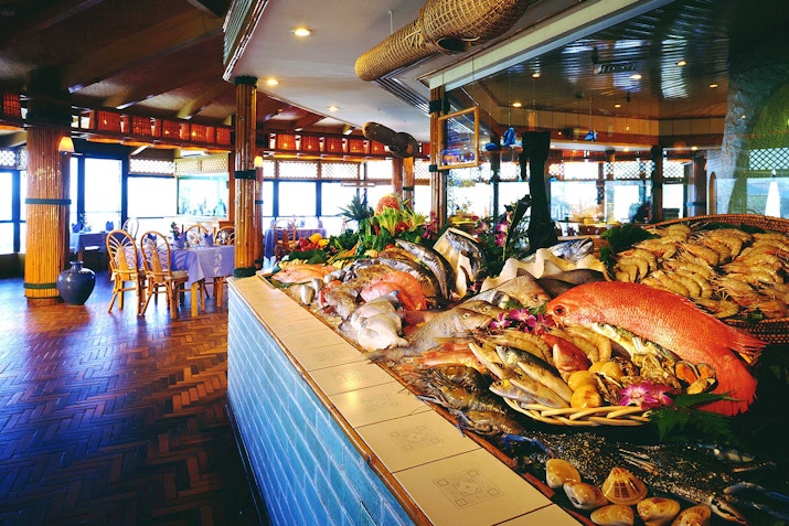 A beautifully displayed seafood buffet with fresh crabs, fish, and shellfish