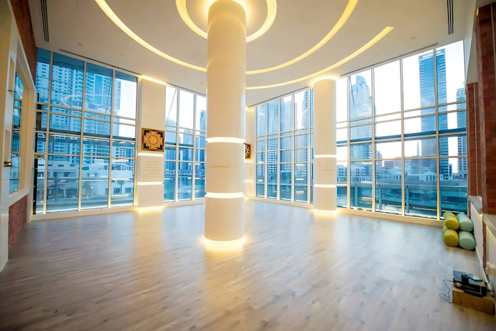 Large floor-to-ceiling windows, wooden floors and unique lighting.