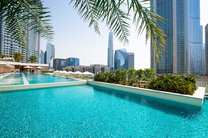 Sofitel Dubai Downtown Infinity pool with a view of modern skyscrapers.
