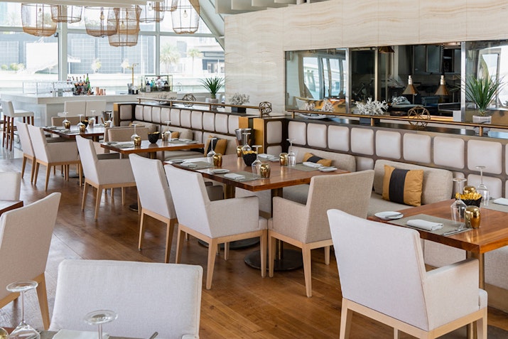 Finz at Beach Rotana Abu Dhabi Elegant dining tables and a contemporary atmosphere