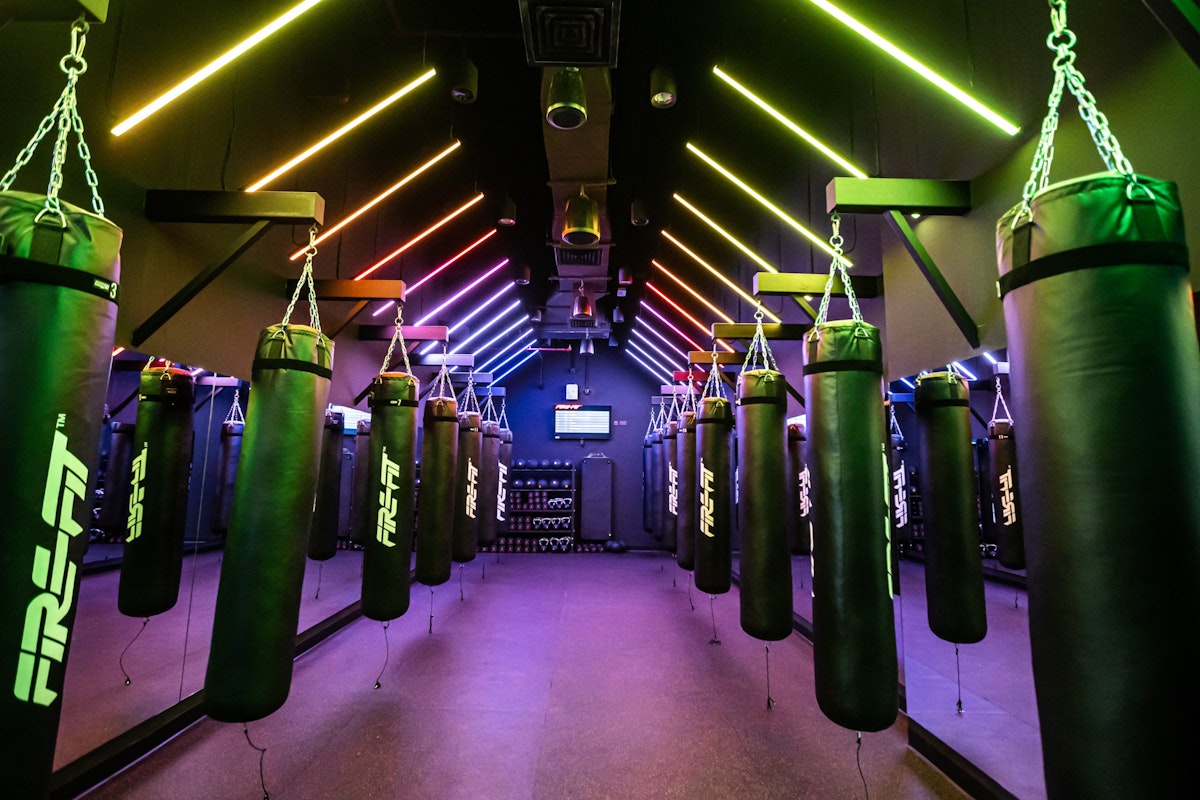 High-energy gym space with advanced equipment and vibrant lighting for dynamic workouts.