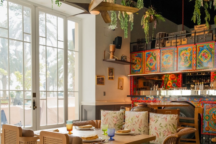 Vibrant interior with Indian-inspired decor and cozy seating.