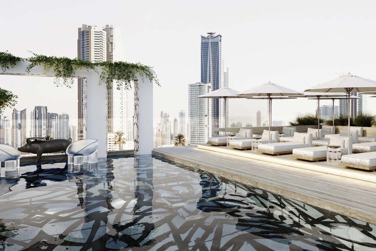 Hyde Hotel Rooftop lounge with a reflective pool, white seating, and parasols.