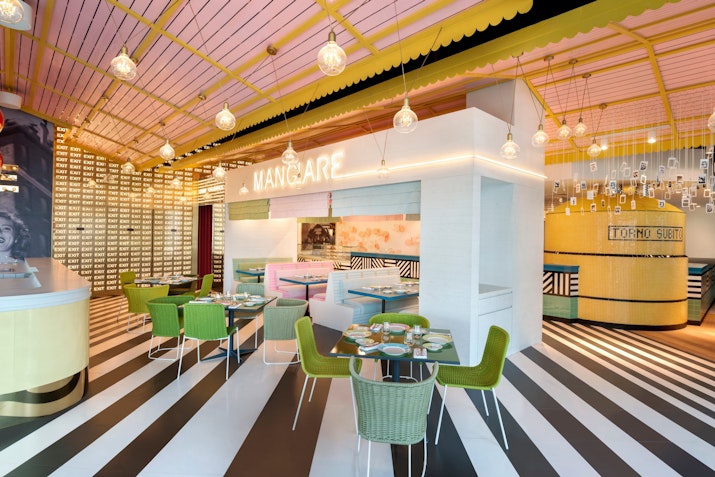 Italian-inspired restaurant with a playful vibe, showcasing vibrant decor and authentic dishes in a stunning waterfront setting