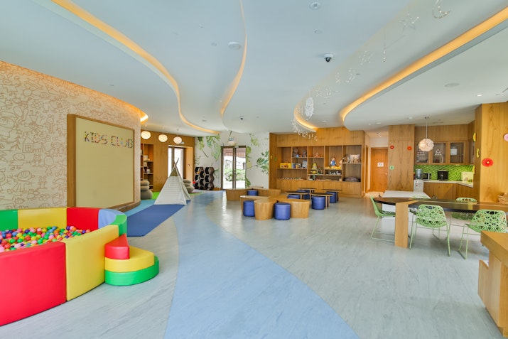 Colorful playroom with a ball pit and kids' furniture.