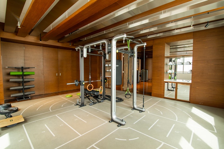 Well-equipped gym with various exercise equipment in a modern fitness center