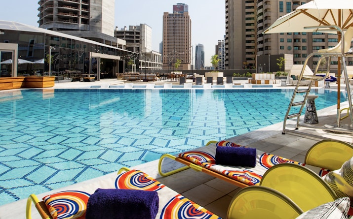 Zabeel House The Greens A peaceful rooftop pool with city views at Zabeel House by Jumeirah, The Greens.