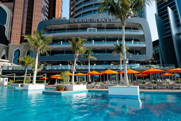 Exterior view of the Grand Hyatt Abu Dhabi with stunning architecture and waterfront surroundings.